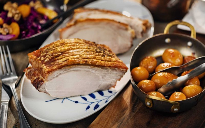 Flaeskesteg or Roast Pork is a traditional Christmas dish in Denmark. The skin of the pork is cut, then salt is rubbed into it. Next, dried bay leaves and cloves are inserted into the cuts to impart a distinctive taste and aroma to the cooked meat.